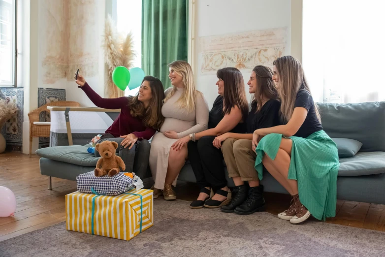 a group of women sitting on top of a couch, a picture, by Emma Andijewska, pexels contest winner, pregnant, at a birthday party, avatar image, high quality upload