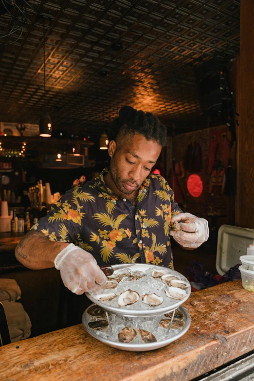 a man preparing a plate of oysters at a bar, by Dan Frazier, donald glover, tattoo artist, stuffed