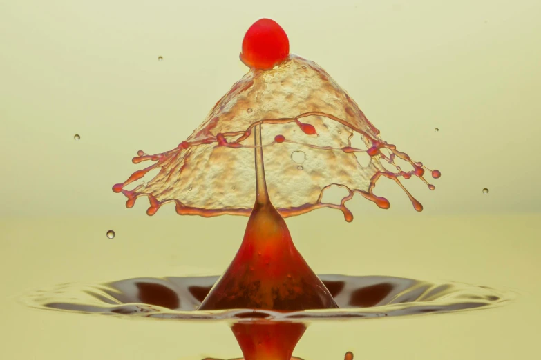 a splash of liquid with a cherry on top of it, by Doug Ohlson, shutterstock contest winner, liquid headdress, photograph taken in 2 0 2 0, whirling, ferrofluid