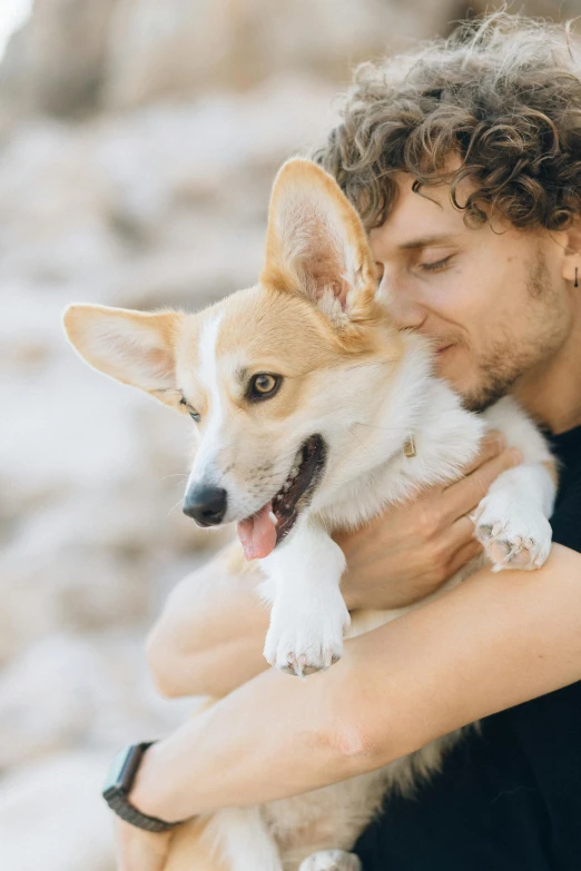 a man holding a dog in his arms, trending on pexels, renaissance, cute corgi, romantic lead, two handsome men, manuka