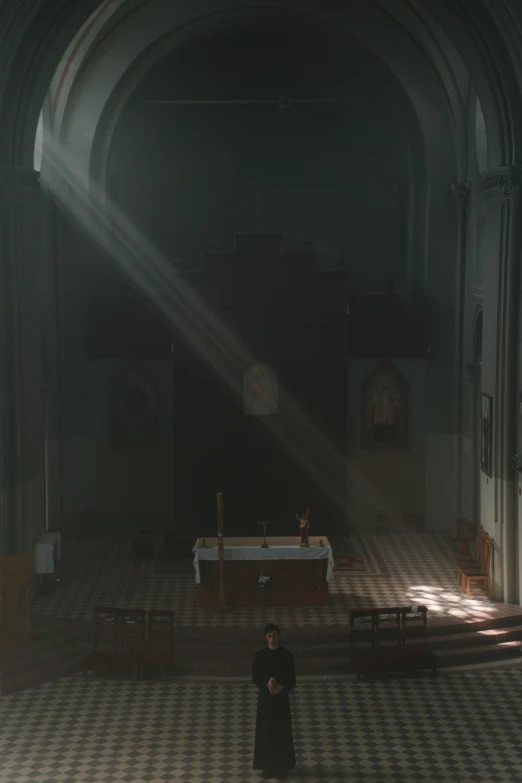 a person standing in a room with a checkered floor, by jessica rossier, conceptual art, dark gloomy church, sunbeams, ignant, tibor nagy