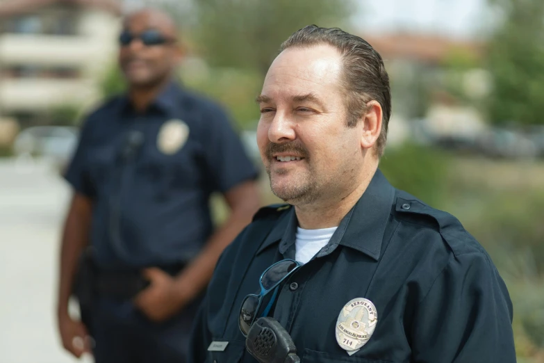 two police officers standing next to each other, a portrait, unsplash, happening, avatar image, matthew perry laughing, bodycam footage, portrait image