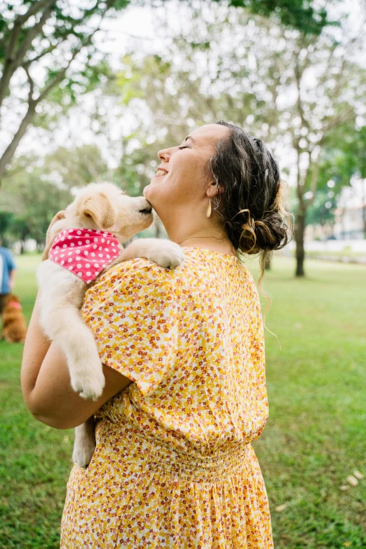 a woman holding a dog in a park, unsplash, happening, playful and cheerful, patterned, in australia, square