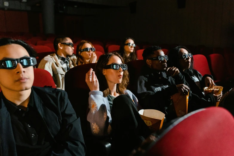 a group of people sitting in a theater wearing 3d glasses, trending on pexels, hyperrealism, instagram post, behind the scenes photo, cinestill, animation
