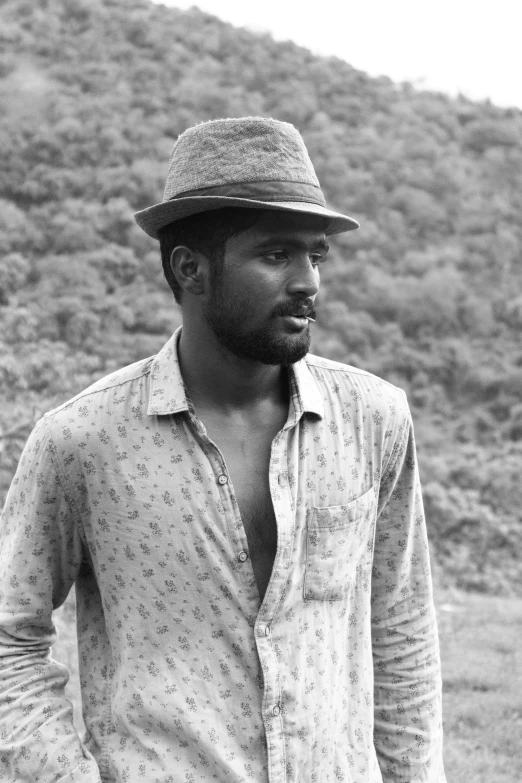 a black and white photo of a man in a hat, by Max Dauthendey, nivanh chanthara, style of castaway ( film ), brown skinned, square