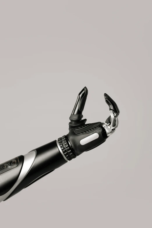 a black and white photo of a hair clipper, a digital rendering, trending on zbrush central, robotic left arm, on a pale background, upper body close - up, robotic arm