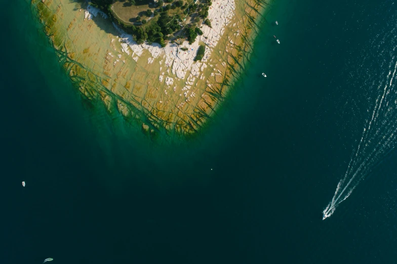 a small island in the middle of the ocean, by Adam Marczyński, pexels contest winner, with water and boats, depth detail, alessio albi, croatian coastline