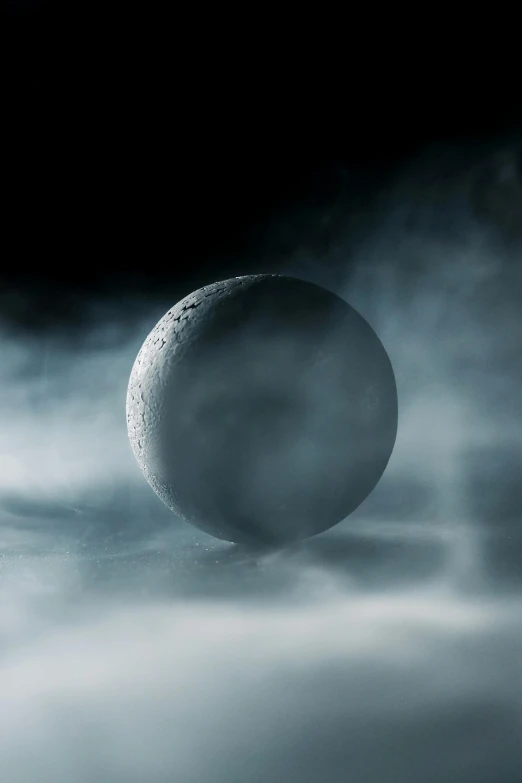 an image of a moon in the sky, an album cover, inspired by Michal Karcz, unsplash contest winner, dense volumetric fog, sphere, cold mist black background, cinematic smooth stone