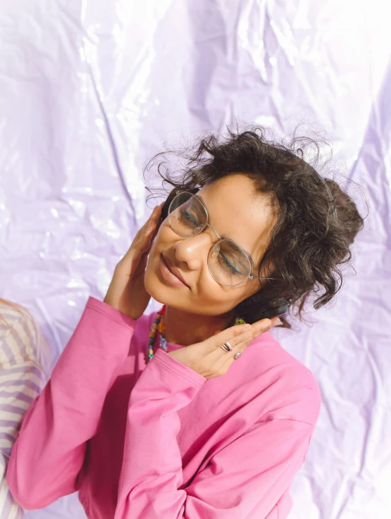 a couple of women standing next to each other, inspired by Charly Amani, trending on pexels, visual art, pink glasses, wearing translucent sheet, isabela moner, wearing a pastel pink hoodie