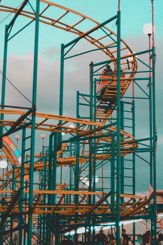 a man riding a roller coaster at a theme park, by Sven Erixson, pexels contest winner, hypermodernism, coloured in teal and orange, scaffolding, ladders, low quality photo