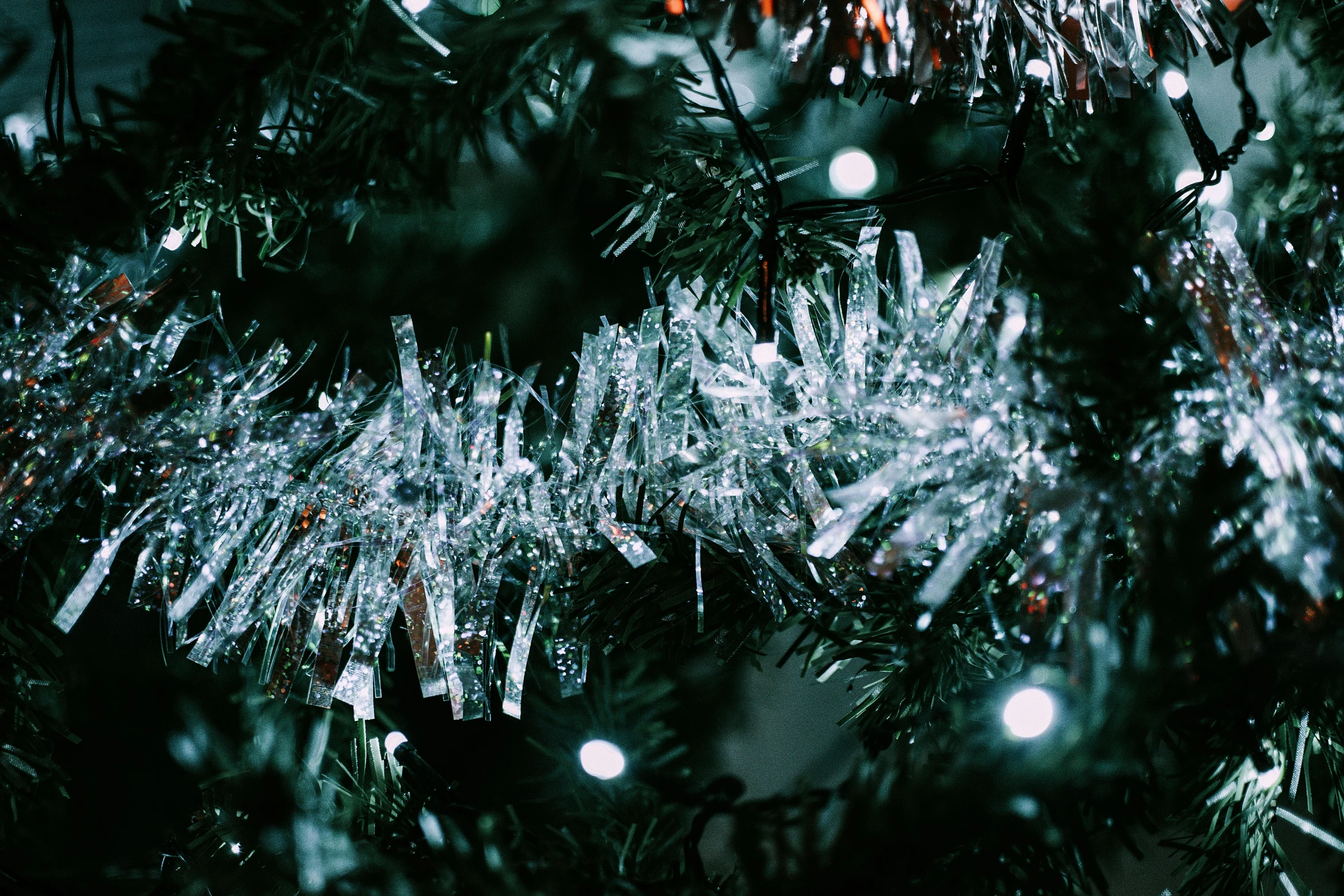 a close up of a christmas tree with icicles on it, pexels, glitter gif, background image, thumbnail