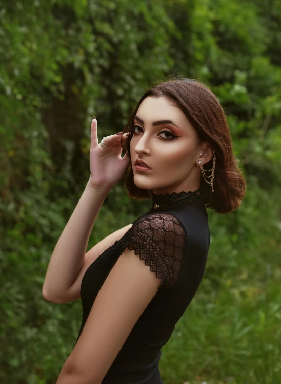 a woman in a black dress talking on a cell phone, an album cover, by Julia Pishtar, trending on pexels, renaissance, ukrainian girl, profile image, 5 0 0 px models, amouranth