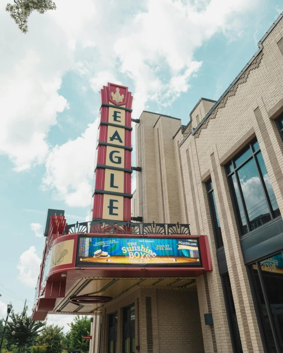 a theater sign on the side of a building, eagles, lgbtq, profile image, thumbnail