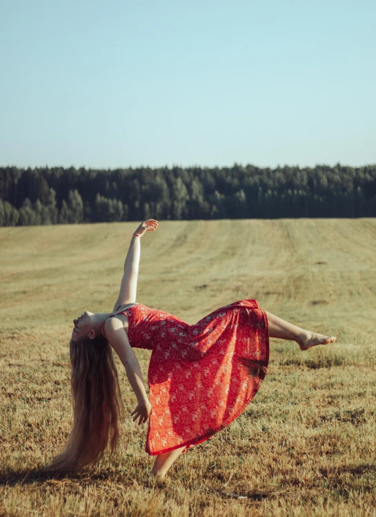 a woman in a red dress doing a handstand in a field, inspired by Anka Zhuravleva, pexels contest winner, arabesque, square, 15081959 21121991 01012000 4k, wearing a flowing sundress, ukrainian