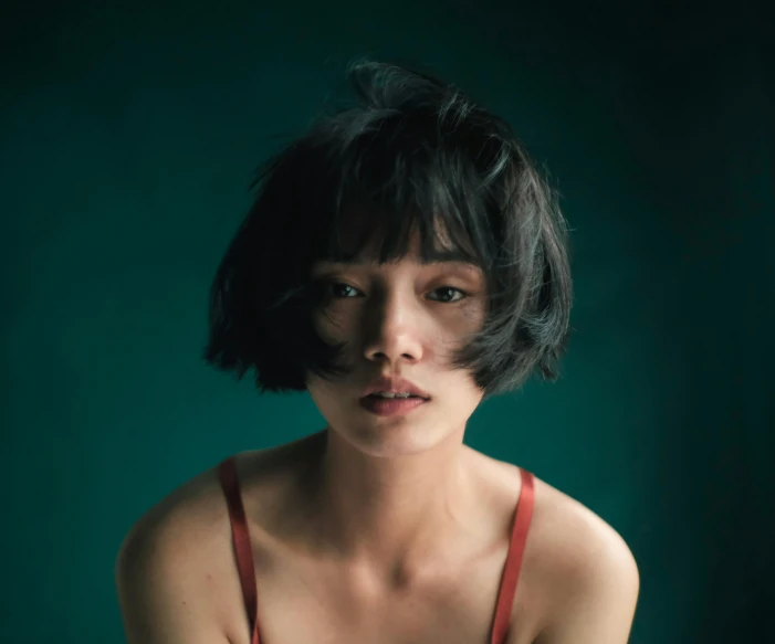 a woman in a red dress posing for a picture, an album cover, inspired by Elsa Bleda, pexels contest winner, hyperrealism, blue short hair, young cute wan asian face, short unkempt green hair, with a bob cut