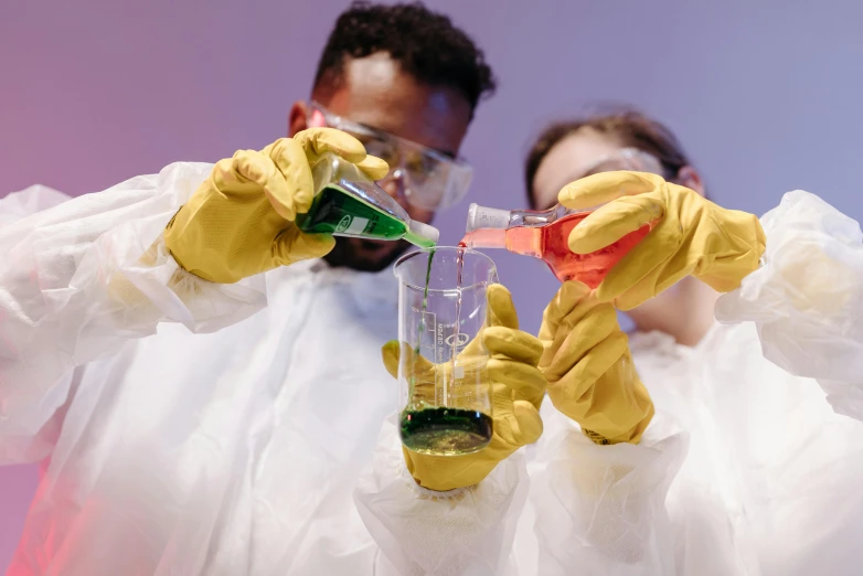 a man and a woman are doing a science experiment, pexels, process art, wearing gloves, colourised, 🚀🌈🤩, labcoat