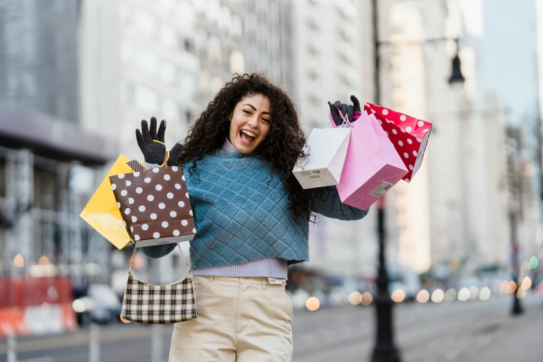 a woman walking down the street holding shopping bags, pexels contest winner, all overly excited, imaan hammam, everyone having fun, a person standing in front of a