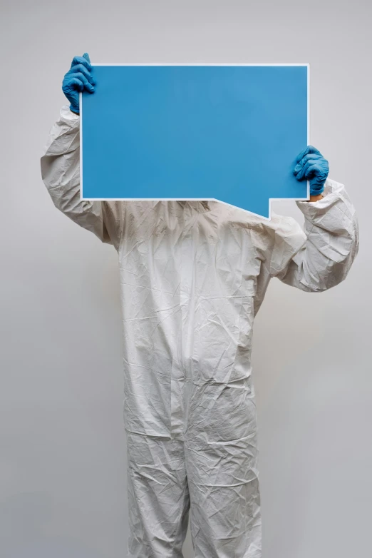 a man in a protective suit holding a blue sign, an album cover, by Paul Bird, unsplash, plasticien, lab coat, very large, hegre, 15081959 21121991 01012000 4k