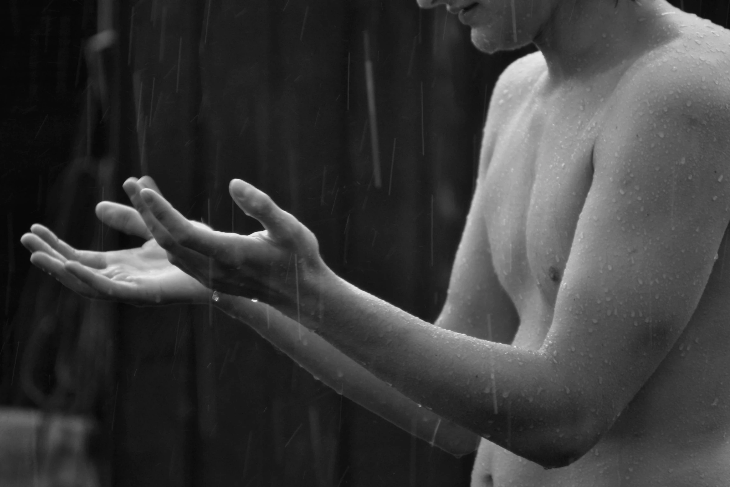 a black and white photo of a boy in the rain, a black and white photo, pexels, conceptual art, perfect body face and hands, milk - bath effect, :: morning, fanart