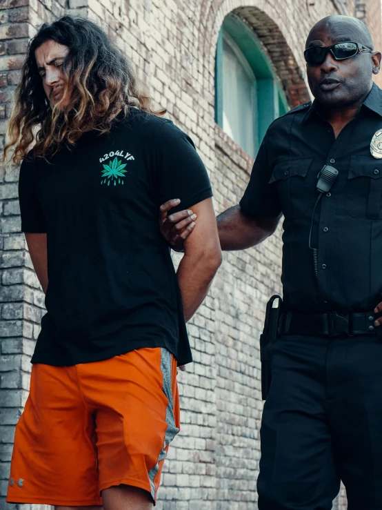 a couple of men standing next to each other, wearing a marijuana t - shirt, arrested, black and orange, trending on vsco