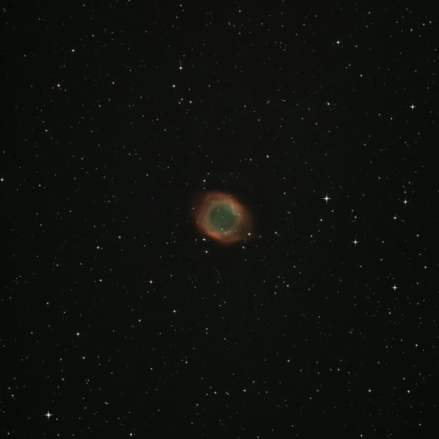 a planetary object in the sky with stars in the background, a microscopic photo, by Neil Boyle, eye of sauron, tardigrade in space, low quality grainy, with a halo of unkempt hair