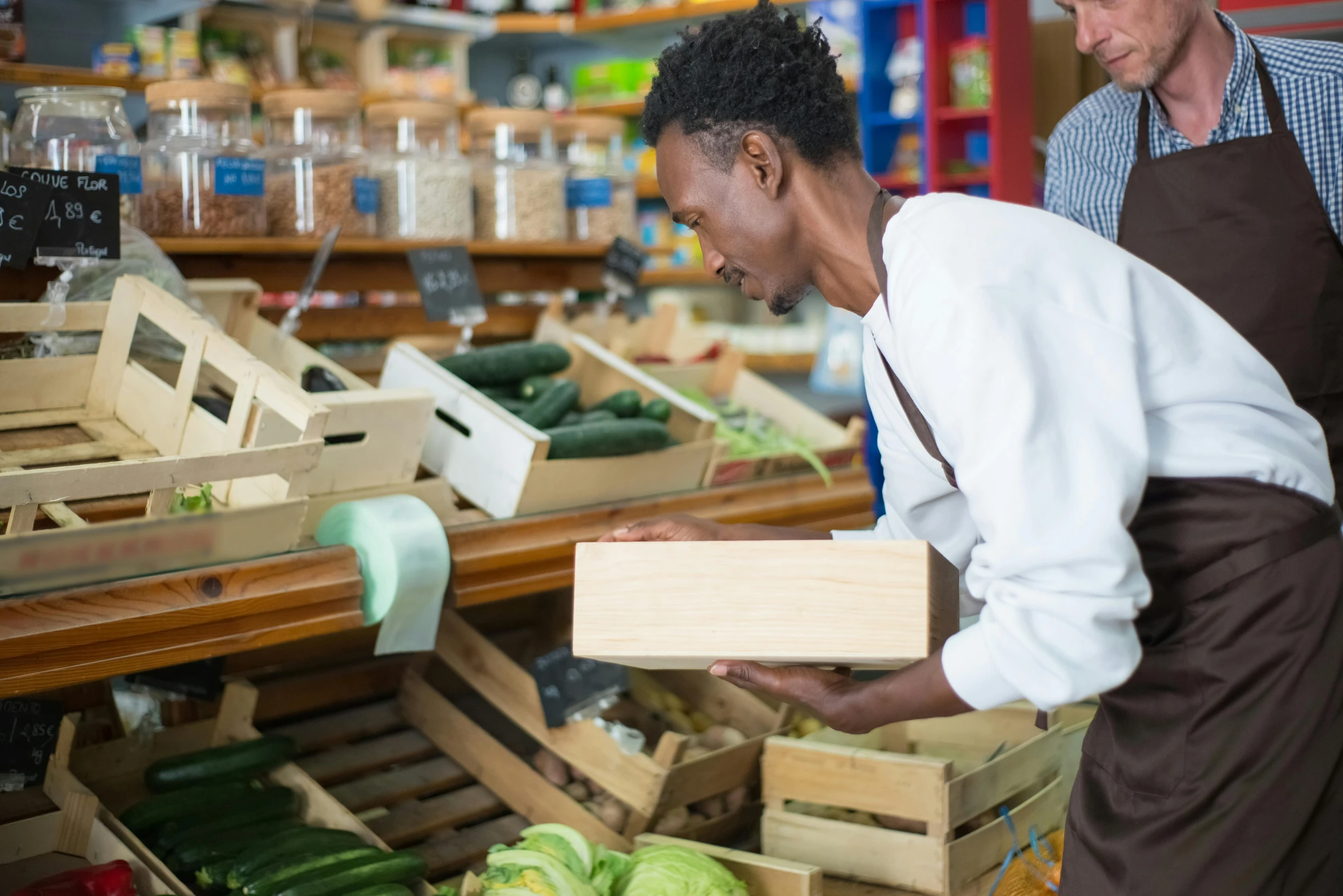 a couple of people that are standing in a store, pexels, renaissance, local foods, wooden crates, avatar image, white