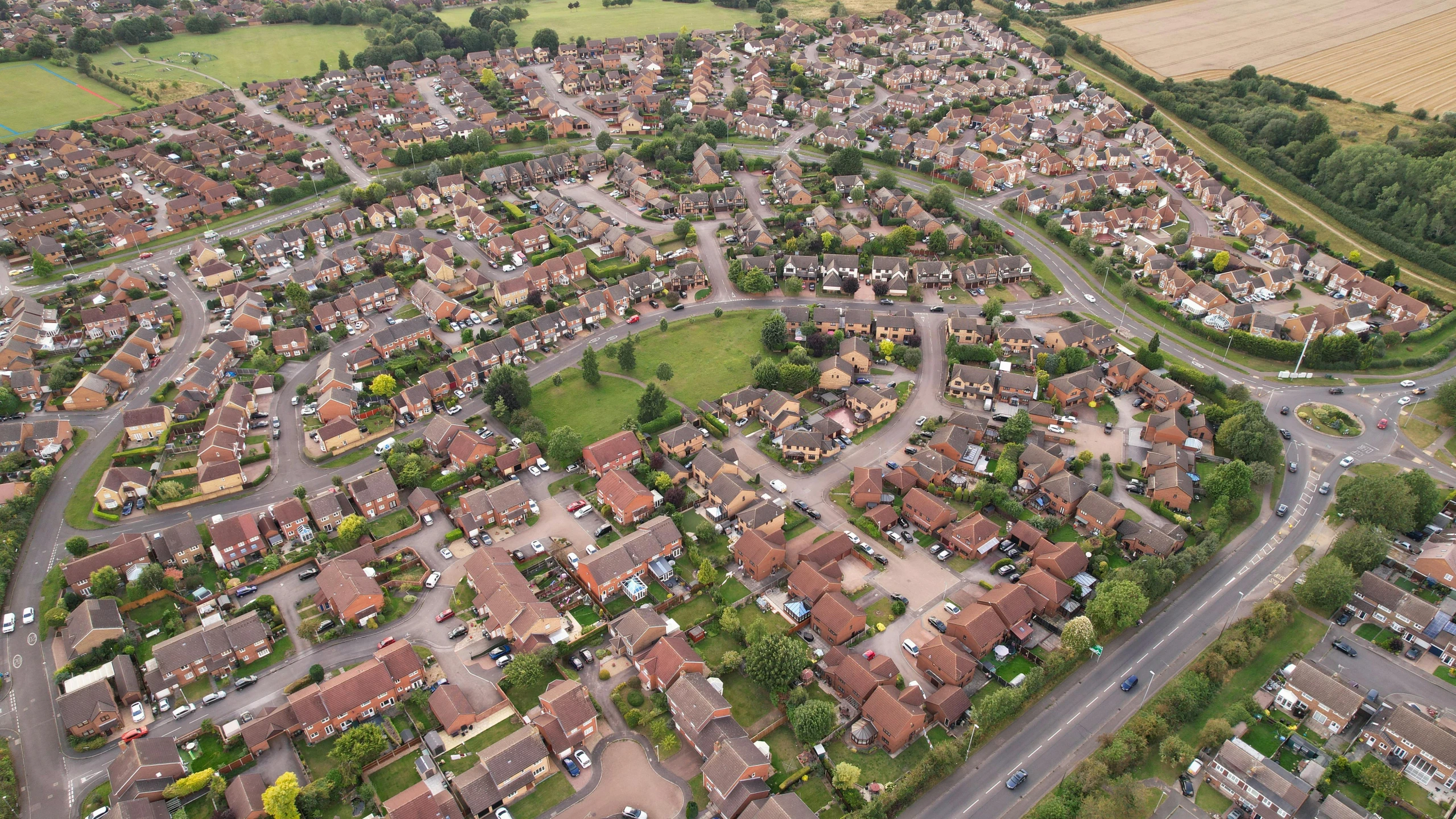 a bird's eye view of a residential area, by Julian Allen, shutterstock, midlands, ultrawide shots, hedges, slight overcast lighting