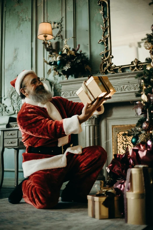 a santa claus sitting in front of a christmas tree, pexels contest winner, in front of a fireplace, holding gift, profile image, gentleman