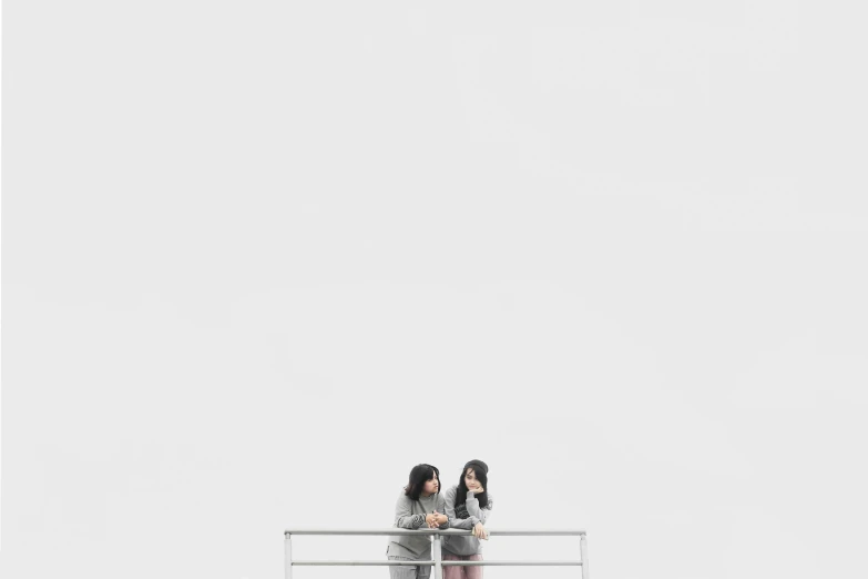 a couple of women standing on top of a bridge, a picture, by Fei Danxu, minimalism, white and grey, smartphone photography, people waiting in bus stop, white background : 3