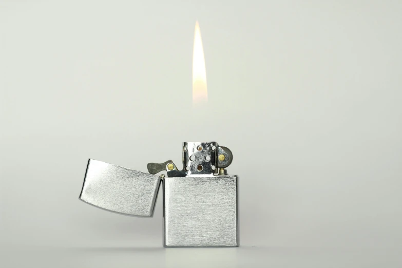 a lighter is lit on a white background, an album cover, by Jan Kupecký, unsplash, chrome silver, glowing firebugs, brilliant photorealism, nmm