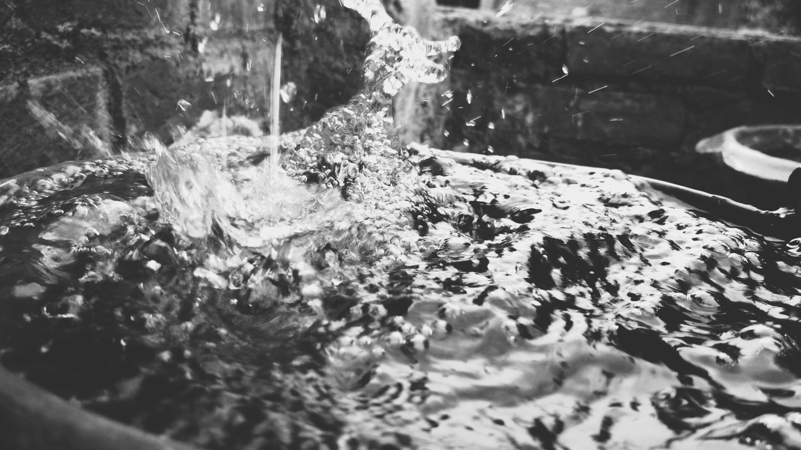 a black and white photo of a water fountain, a black and white photo, by Cherryl Fountain, unsplash, conceptual art, painting of splashing water, detailed medium format photo, unfocused, fractals!! water