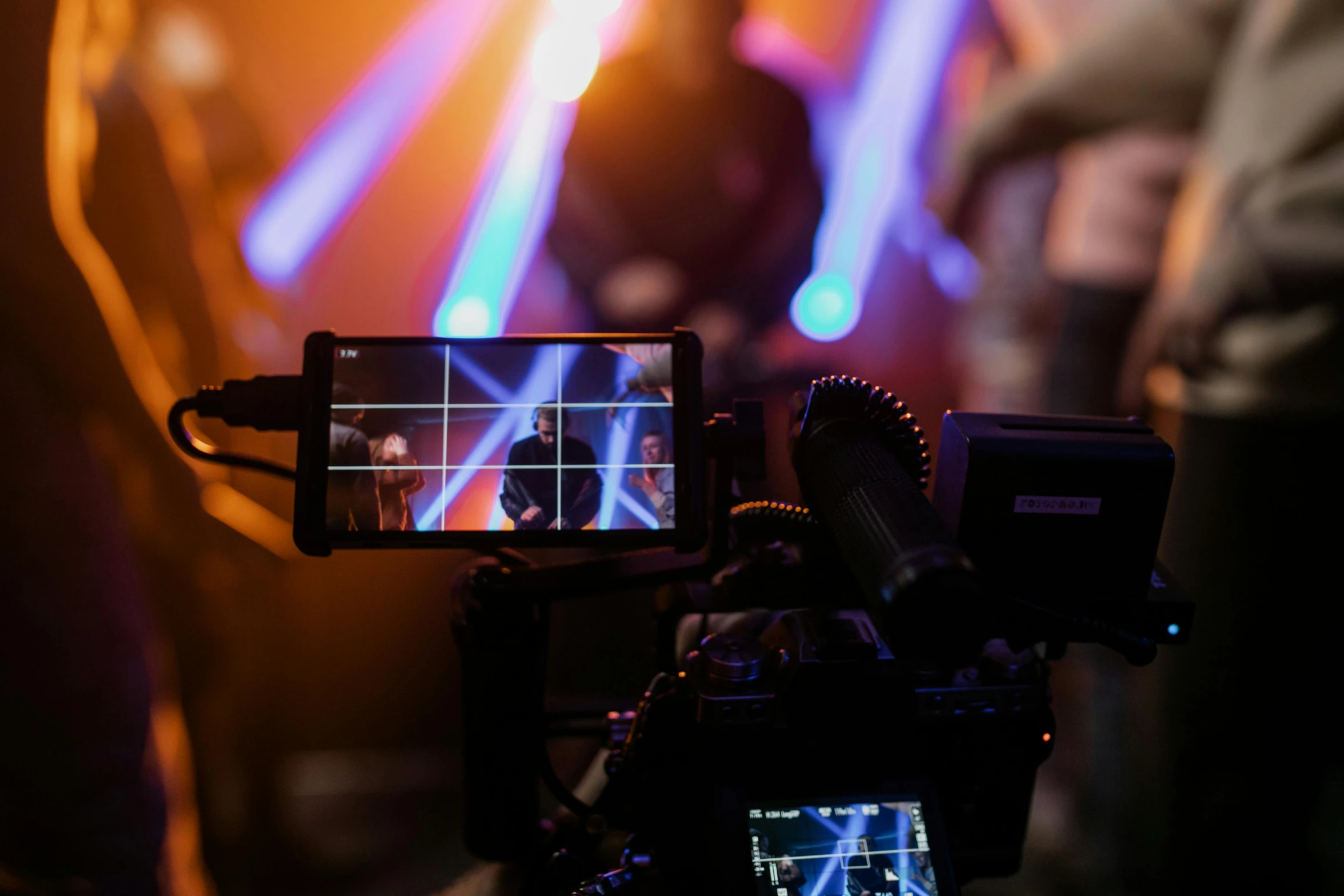 a close up of a video camera on a tripod, pexels, video art, concert lighting, tv screens in background, music being played, avatar image