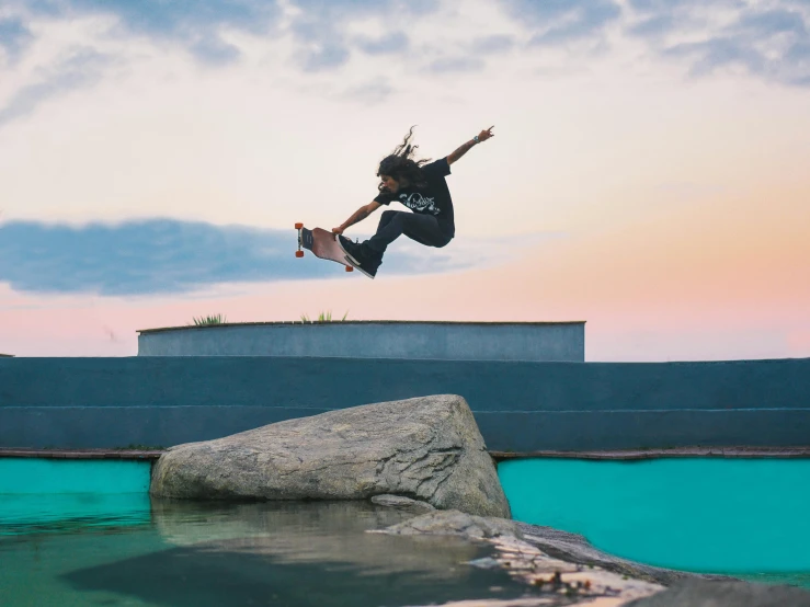 a man flying through the air while riding a skateboard, by Cam Sykes, unsplash contest winner, happening, positing on rock super hero pose, parkour, a woman floats in midair, skate park