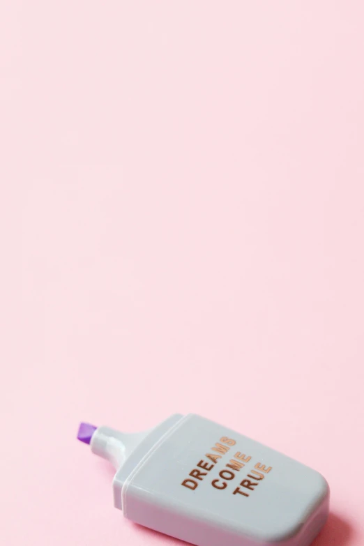 a bottle of toothpaste sitting on top of a pink surface, by Russell Dongjun Lu, concept photo, holding pencil, cosmopolitan, lilac