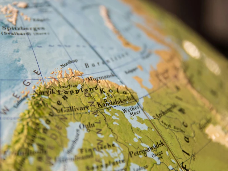 a close up of a map of the world, by Jesper Knudsen, trending on unsplash, regionalism, northern finland, inside a globe, thumbnail, instagram post