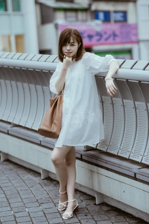 a woman sitting on a bench talking on a cell phone, by Miyamoto, happening, wearing a cute white dress, けもの, 🤤 girl portrait, casual clothing style