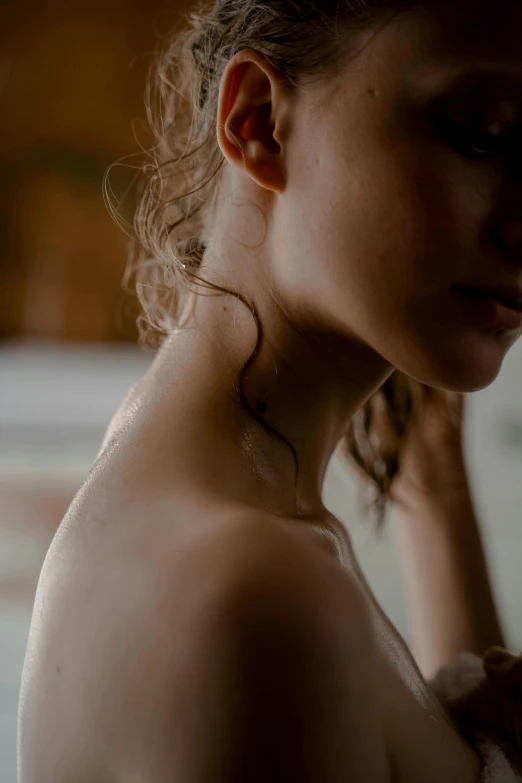 a woman that is standing in front of a mirror, a tattoo, inspired by Elsa Bleda, trending on pexels, renaissance, on a young beautiful woman neck, rippling muscles, soft light from the side, spa