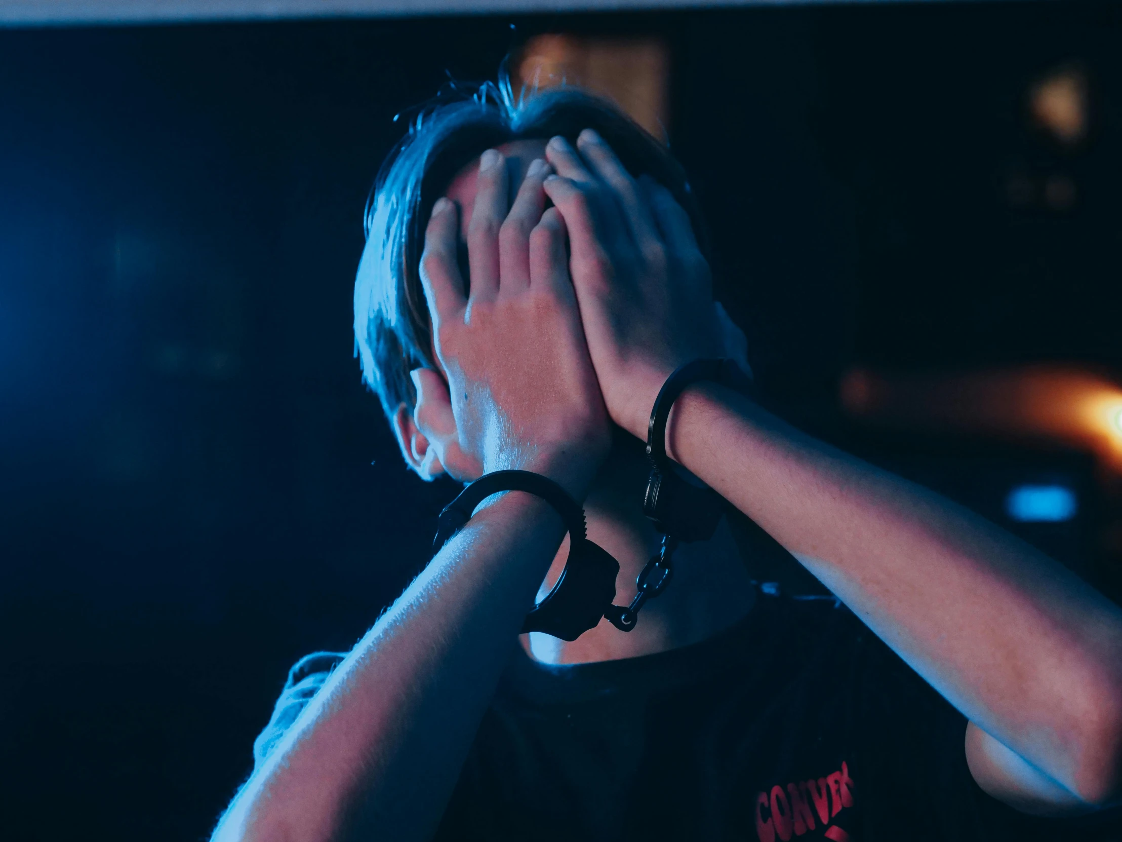 a person covering their face with their hands, trending on pexels, handcuffed, twitch streamer / gamer ludwig, depressed dramatic bicep pose, 15081959 21121991 01012000 4k