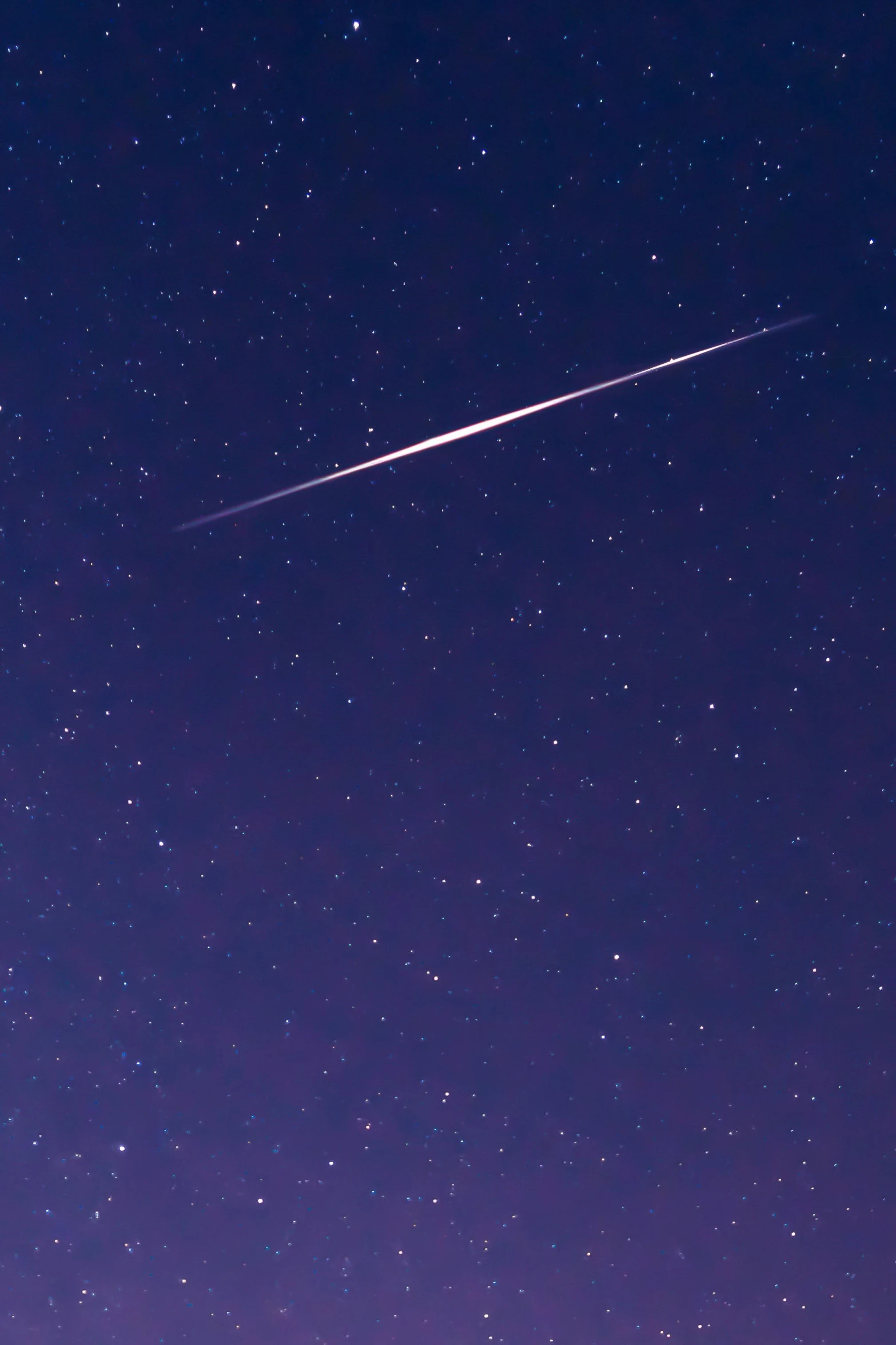 a plane is flying through the night sky, by Niko Henrichon, trending on pexels, conceptual art, meteorites, rinko kawauchi, rectangle, long