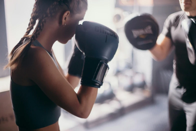 a man and a woman boxing in a gym, pexels contest winner, manuka, 🦩🪐🐞👩🏻🦳, closeup photograph, miranda meeks