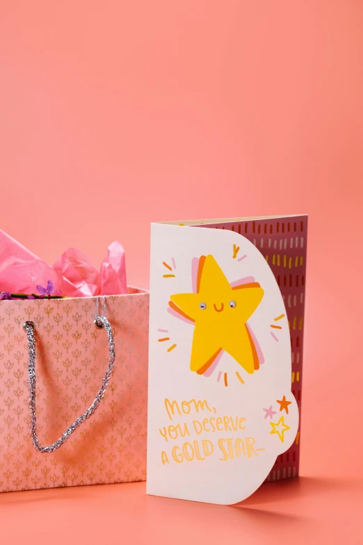 a birthday card in a gift bag on a pink background, by Julia Pishtar, star shining in space, your mom, carson ellis, centered shot