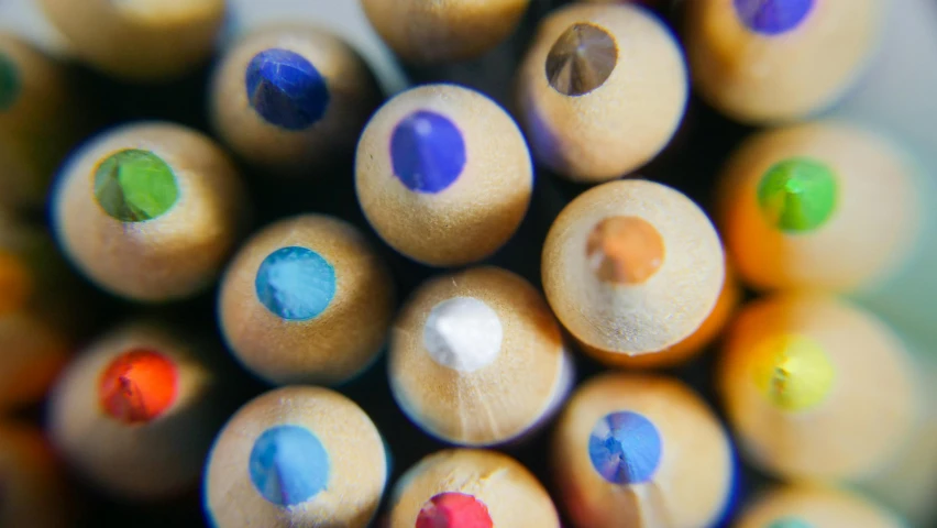 a close up of a bunch of colored pencils, by Niko Henrichon, trending on pexels, pointillism, a wooden, dot pupils, thumbnail, multiple stories