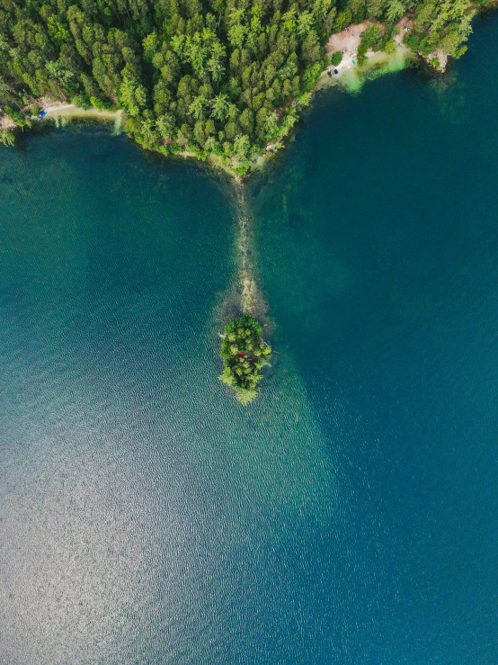 a small island in the middle of a lake, pexels contest winner, head straight down, thumbnail, 4k image”