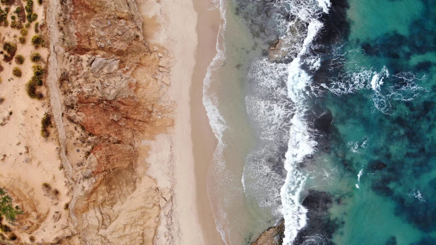 a large body of water next to a sandy beach, pexels contest winner, birdseye view, malibu canyon, deeply hyperdetailed, australian beach