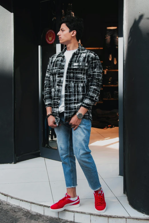 a man standing in the doorway of a building, by Robbie Trevino, cute casual streetwear, flannel, 15081959 21121991 01012000 4k, cropped shirt with jacket