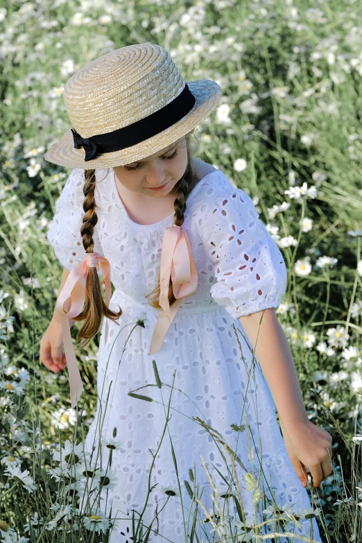 a little girl standing in a field of flowers, inspired by Kate Greenaway, pexels contest winner, renaissance, white straw flat brimmed hat, laces and ribbons, shadows, elle fanning