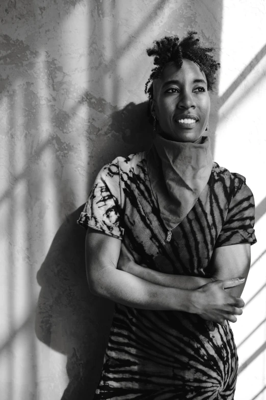 a black and white photo of a man leaning against a wall, black arts movement, ashteroth, covered in bandages, an epic non - binary model, somali woman