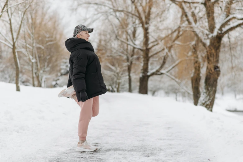 a woman in a black jacket and pink pants standing in the snow, pexels contest winner, wearing white tights, profile image, sneaker photo, thumbnail