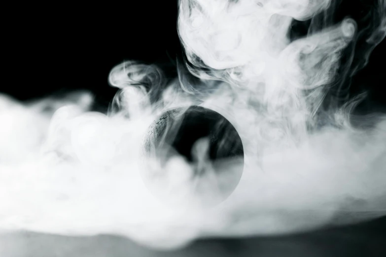 a black and white photo of smoke coming out of a frying pan, an album cover, inspired by Otto Piene, pexels contest winner, ghost sphere, close - up photograph, energy spheres, instagram post