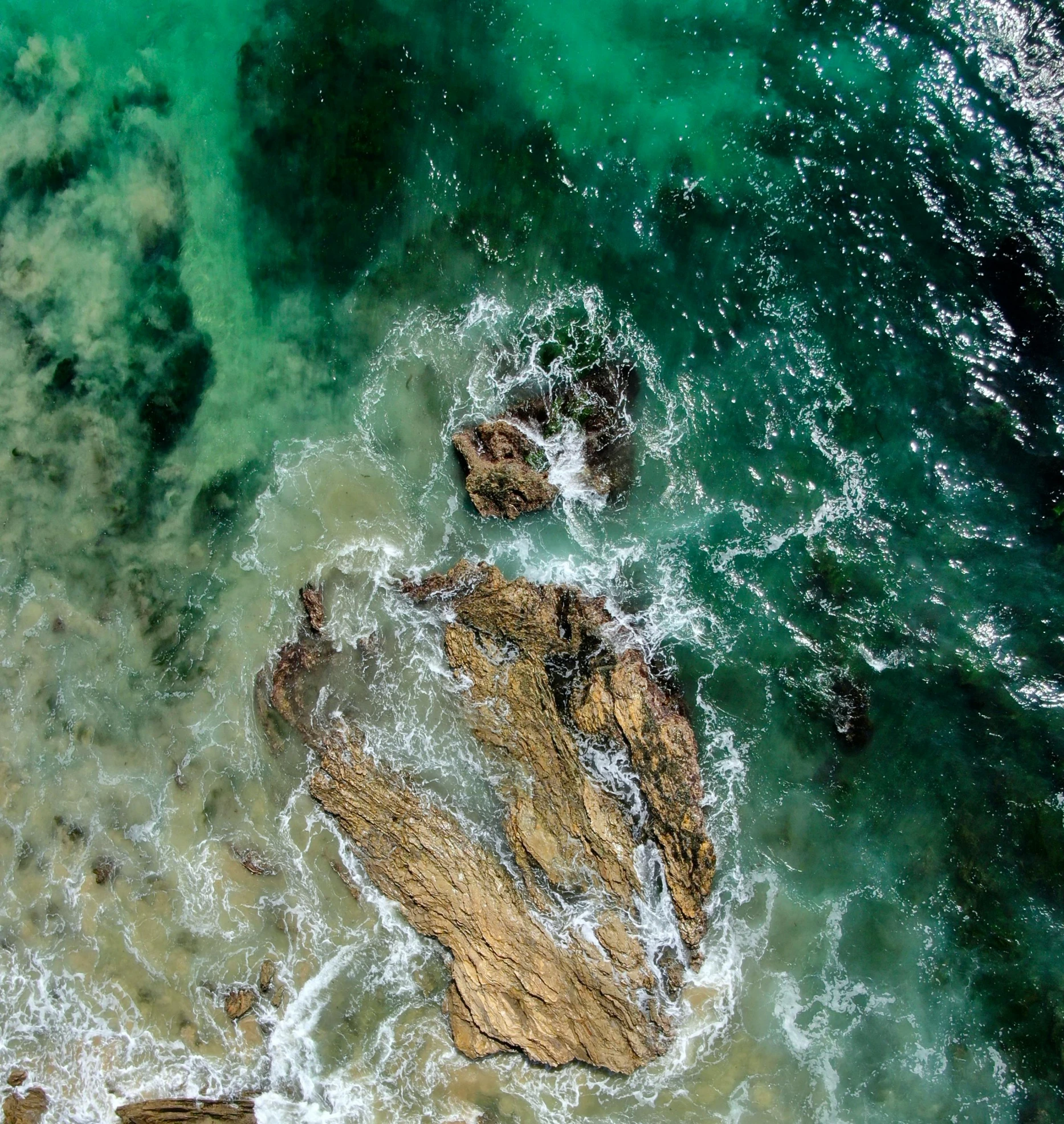 a view of the ocean from a bird's eye view, pexels contest winner, rock pools, green water, liquid light, profile pic